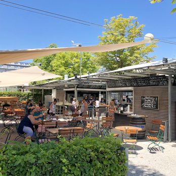 Hafenhalle - Outdoor shaded seating on a sunny day - German Near Me - Konstanz, BW Hafenhalle - Outdoor shaded seating on a sunny day - German Near Me - Konstanz, BW