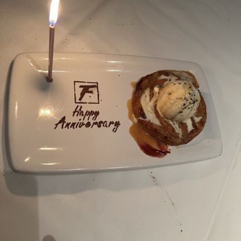 Fleming’s Prime Steakhouse & Wine Bar - Apple slices, salted caramel drizzle, vanilla ice cream with a side of whipped cream. Absolutely delicious! - Steakhouses Near Me - Memphis, Tennessee
