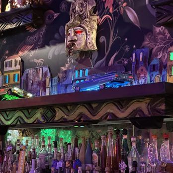 Cantina Tequila - Wall art in bar featuring two lowrider models crashing into each other. - Mexican Near Me - Henderson, Nevada