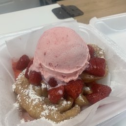 Funnel cake with Strawberries and strawberry ice cream. Funnel cake with Strawberries and strawberry ice cream.