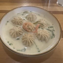 Beef Momo with chili cheese sauce Beef Momo with chili cheese sauce