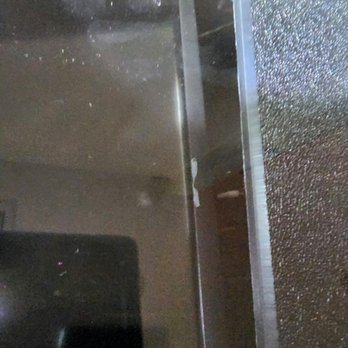 In The New Age - Remnants of the double stick tape holding up the screen. What a joke. - Videos & Video Game Rental Near Me - Chicago Heights, Illinois