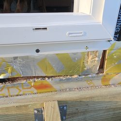 Archadeck of Central Maine - The owner said he didn't see anything wrong with this. There's was no water barrier behind ledger or pan flashing for sliding door.