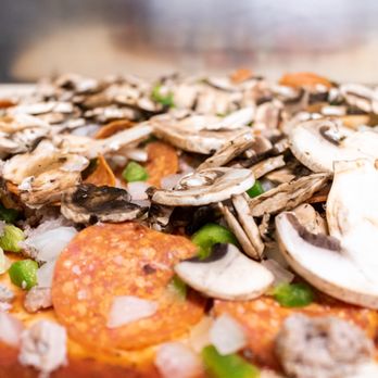 DJs Pizza - a pizza topped with mushrooms and onions - Pizza Near Me - Huntsville, Alabama DJs Pizza - a pizza topped with mushrooms and onions - Pizza Near Me - Huntsville, Alabama