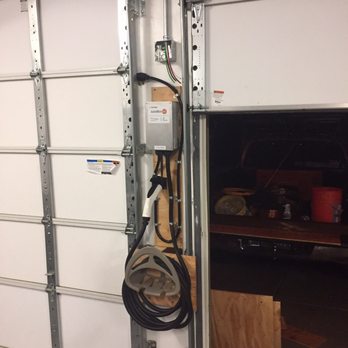 Moeller Electric - Squeeze the car charger in between garage doors - Electricians Near Me Moeller Electric - Squeeze the car charger in between garage doors - Electricians Near Me