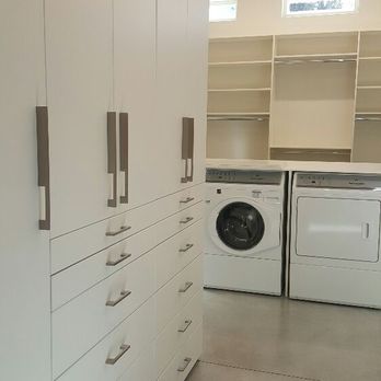 Miters Touch - A large walk-in closet in the white melamine color. - Home Organization Near Me - Aurora, Colorado