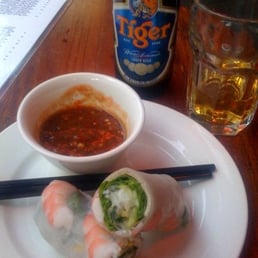 Photo of Blossom - Los Angeles, CA, United States. a tiger and some spring rolls