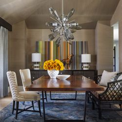 Andrea Schumacher Interiors - An eclectic dining room we designed around the client's art. Grasscloth wallpaper on all walls and the ceiling create a luxurious feel.