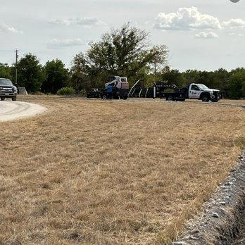 Advanced Bobcat Solutions - a group of vehicles in a field - Tree Services Near Me - Temple, Texas Advanced Bobcat Solutions - a group of vehicles in a field - Tree Services Near Me - Temple, Texas