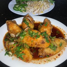The wings super crispy topped with a delicious fish sauce. The wings super crispy topped with a delicious fish sauce.