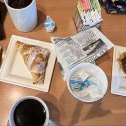 Wild Flour Bakery - L-R: Almond pastry, cherry turnover, molasses cookie (inside newsprint-style wrapper), and pecan/chocolate/coconut pie