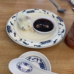 a plate of food and a bowl of sauce