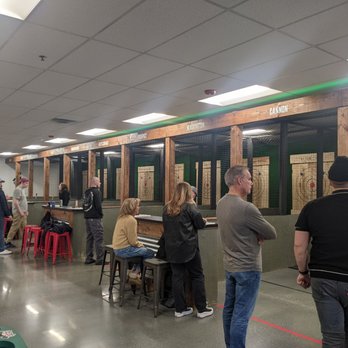 The Rugged Axe - a group of people standing in a room - Axe Throwing Near Me - Manchester, New Hampshire