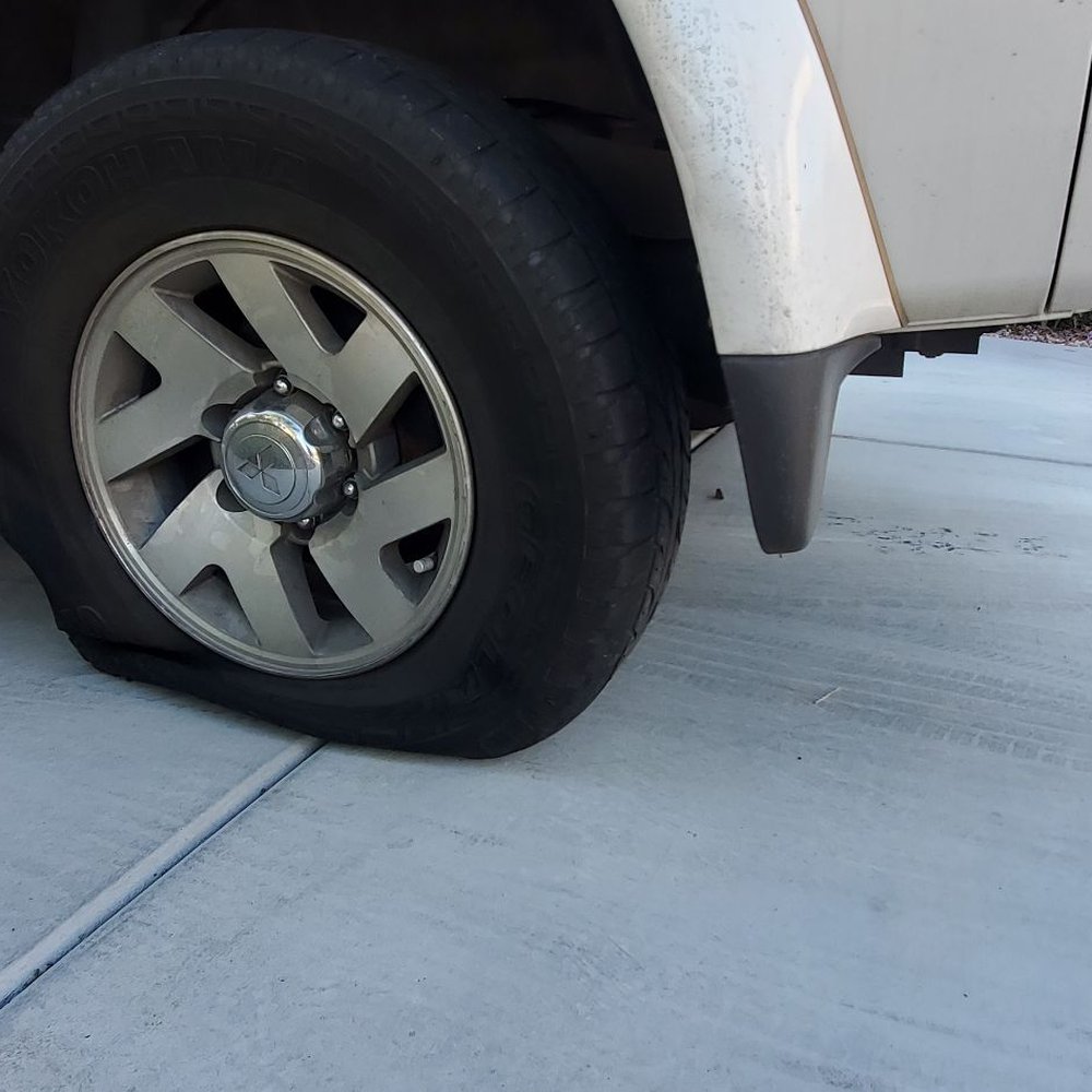 Major League Towing - Another view of the torn tire. No damage on the outside. Clearly torn by being towed. - Towing Near Me Major League Towing - Another view of the torn tire. No damage on the outside. Clearly torn by being towed. - Towing Near Me