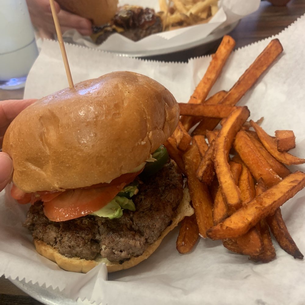 The Mexican burger with sweet potato fries and the Texan burger with regular fries The Mexican burger with sweet potato fries and the Texan burger with regular fries