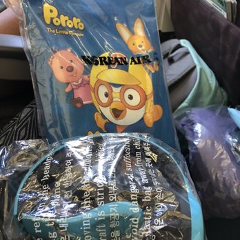 Korean Air - Gift for kids (small coloring book and crayons) and headphones that are offered and recollected in flight - Airlines Near Me - Chicago, Illinois