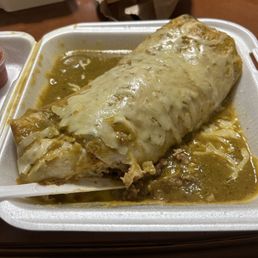 Wet burrito asada and shrimp with green sauce. Best burrito in town