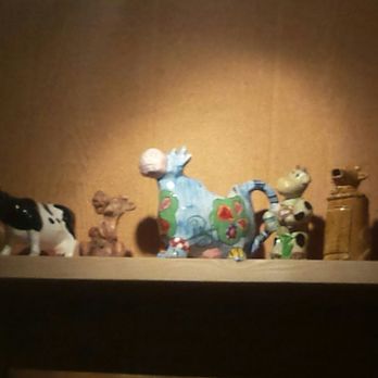 Village Cafe - Don't have a cow.  Have several:  This moovelous bovine wall display adds to the charm of this place. - Cafes Near Me - Brooklyn, New York