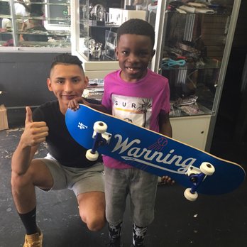 Warning Skate Shop - Chema presenting my son with his first board. - Skate Shops Near Me - Los Angeles, California Warning Skate Shop - Chema presenting my son with his first board. - Skate Shops Near Me - Los Angeles, California