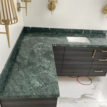 Stone Stock Workers - a marble worktop in a bathroom - Countertop Installation Near Me Stone Stock Workers - a marble worktop in a bathroom - Countertop Installation Near Me