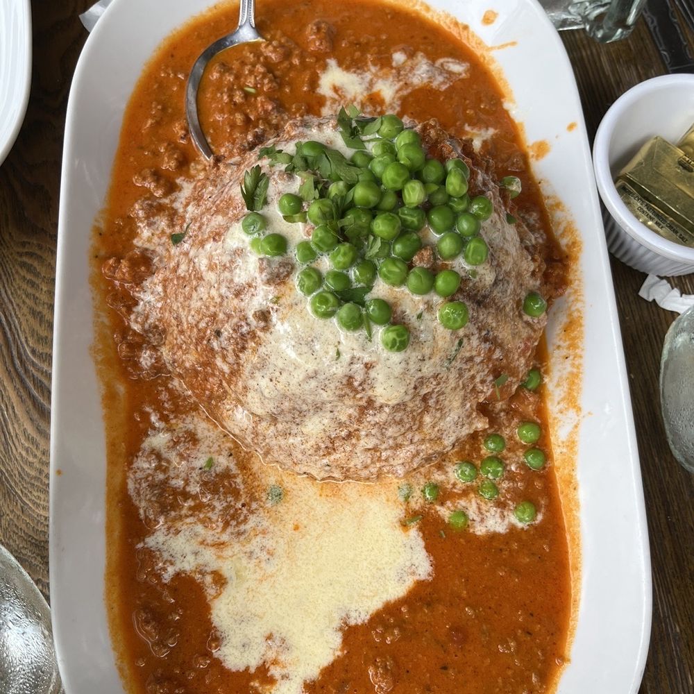 Eat Italian - a bowl of soup with peas and parmesan cheese - Italian Near Me - Staten Island, New York