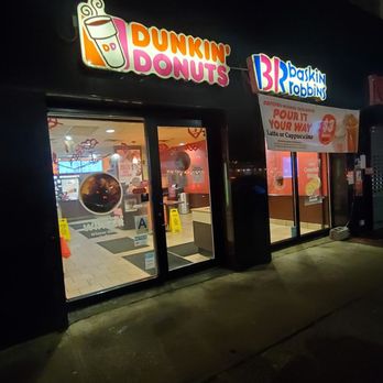 Dunkin' -  the outside of a dunkin donuts store at night - Donuts Near Me - Astoria, New York