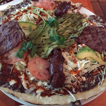 La Carta de Oaxaca - Tlayuda... Mexican pizza- a giant tortilla with beans, quesillo, asiento, cabbage, avocado, chorizo sausage, and skirt steak - Mexican Near Me - Seattle, Washington La Carta de Oaxaca - Tlayuda... Mexican pizza- a giant tortilla with beans, quesillo, asiento, cabbage, avocado, chorizo sausage, and skirt steak - Mexican Near Me - Seattle, Washington