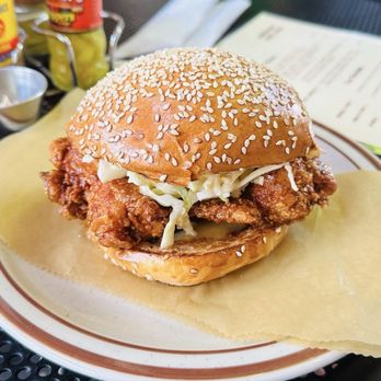 Kinfolk - Fried chicken sammie dipped in the classic Kinfolk sauce with slaw and pickles - Coffee & Tea Near Me - Memphis, Tennessee