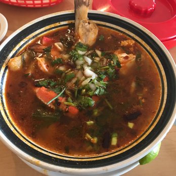 Mi Cabana - a bowl of soup with a spoon in it - Mexican Near Me - Austin, Texas