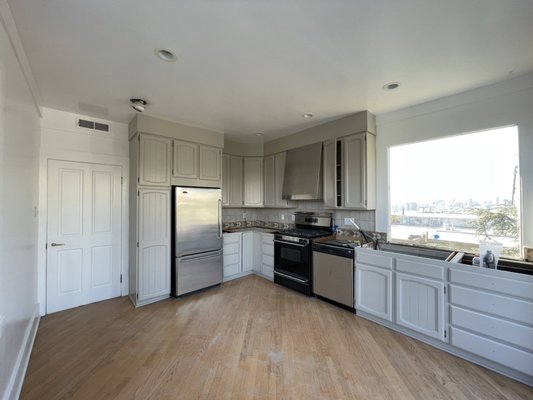 Kitchen remodel - Kitchen update in San Francisco-removed stains from cabinets, painted in satin pale oak, Benjamin Moore. Walls in off white