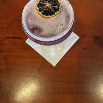 Chops + Hops Axe Throwing Lodge - Shut Up Meg with blue coat gin, butterfly, pea flower infused honey, lemon, basil, and grapefruit soda. - Axe Throwing Near Me - Fort Lauderdale, Florida Chops + Hops Axe Throwing Lodge - Shut Up Meg with blue coat gin, butterfly, pea flower infused honey, lemon, basil, and grapefruit soda. - Axe Throwing Near Me - Fort Lauderdale, Florida
