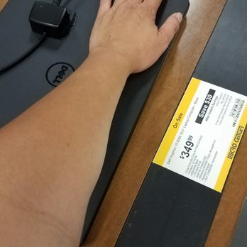 Micro Center - Laptop shopping - measuring with my arm. They are all the same. - Electronics Near Me - Houston, Texas