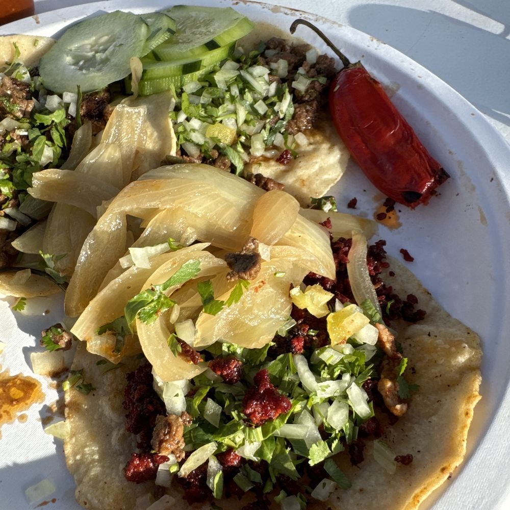 Tacos El Tigre - Chorizo taco in the foreground - Tacos Near Me - Watsonville, California Tacos El Tigre - Chorizo taco in the foreground - Tacos Near Me - Watsonville, California
