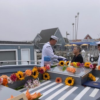 Sea Star Burials at Sea - Navy presenting the flag to my mom - Funeral Services & Cemeteries Near Me - Oceanside Harbor, California