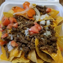 nachos in a styrofoam container nachos in a styrofoam container