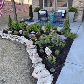 Texas Quality Lawn Care - a flower bed in front of a house - Lawn Services Near Me Texas Quality Lawn Care - a flower bed in front of a house - Lawn Services Near Me