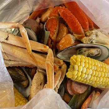 The Monster Crab - Combo C: two snow crab legs, New Zealand mussels, shrimp, corn, potatoes, sausage added on. Sauce on the side, so this bag is steamed plain - Cajun/Creole Near Me - Bayside, New York The Monster Crab - Combo C: two snow crab legs, New Zealand mussels, shrimp, corn, potatoes, sausage added on. Sauce on the side, so this bag is steamed plain - Cajun/Creole Near Me - Bayside, New York