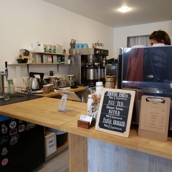 Ephraim Coffee Lab - a woman working in the background - Coffee Roasteries Near Me - Ephraim, Wisconsin