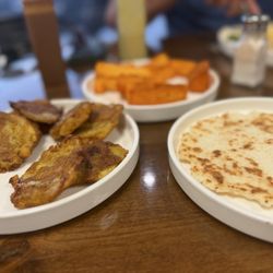 Tostones, arepa and Yucca fries