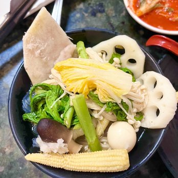 Hot Pot City - My bowl of yummy soup; lotus roots, taro, young corn, mushrooms, quail egg, enoki, Napa, and Chrysanthemum greens - Vietnamese Near Me - Westminster, California