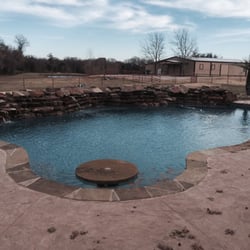 Parker County Pools - Free form pool with table and waterfall