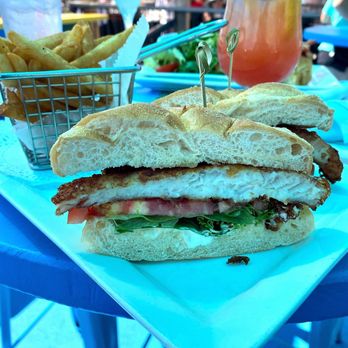 Riley's By the Seawall - Fried fish sandwich with fries - American Near Me - Stratford, Connecticut Riley's By the Seawall - Fried fish sandwich with fries - American Near Me - Stratford, Connecticut