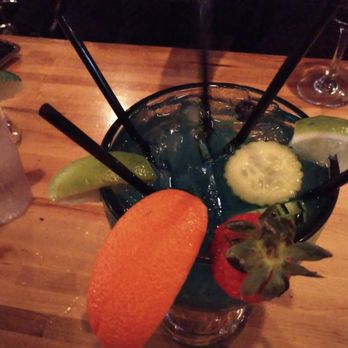 Gra Pow - Tsunami - garnished with cucumber, lime, orange and strawberry. - Thai Near Me - Riverside, California
