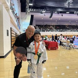 Sparks Taekwondo - Master Jef giving his all out support for my son on his first competition