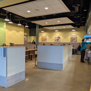 Olga's Fresh Grille - Dining area. I like how the walls block a lot of the potential drafts from the front door - Mediterranean Near Me - Comstock Park, Michigan