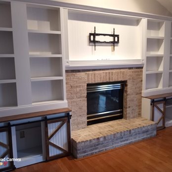 Elite Mechanical Construction Group - Start to finish entertainment wall added custom brick fireplace with gas log set Barn door style cabinetry - Electricians Near Me Elite Mechanical Construction Group - Start to finish entertainment wall added custom brick fireplace with gas log set Barn door style cabinetry - Electricians Near Me