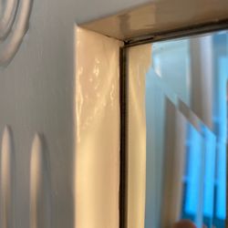 Dripping of paint on bathroom mirror