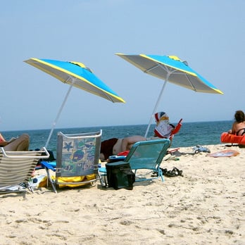Nauset Beach - Rented umbrellas and sunbathers on Nauset Beach - Beaches Near Me - Orleans, Massachusetts