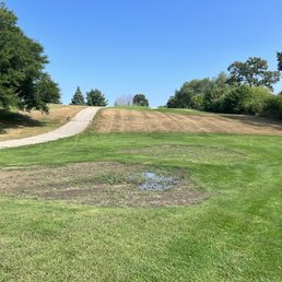 Sand traps, no sand, weeds, and standing water Sand traps, no sand, weeds, and standing water