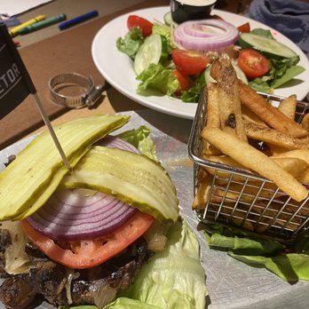 Ford's Garage Estero - The Low Carb Uretor Burger w/ fries and the Side House Saladq - Bars Near Me - Estero, Florida Ford's Garage Estero - The Low Carb Uretor Burger w/ fries and the Side House Saladq - Bars Near Me - Estero, Florida